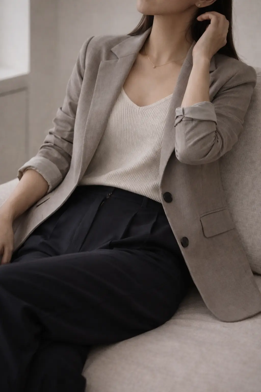 Quiet luxury outfit with taupe blazer and black base styled in a calm, repeatable way.